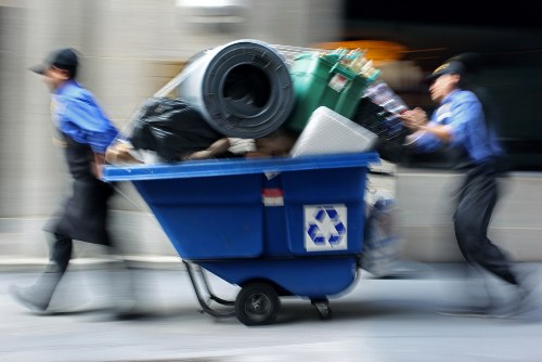 Worker preparing protective gear before handling green waste
